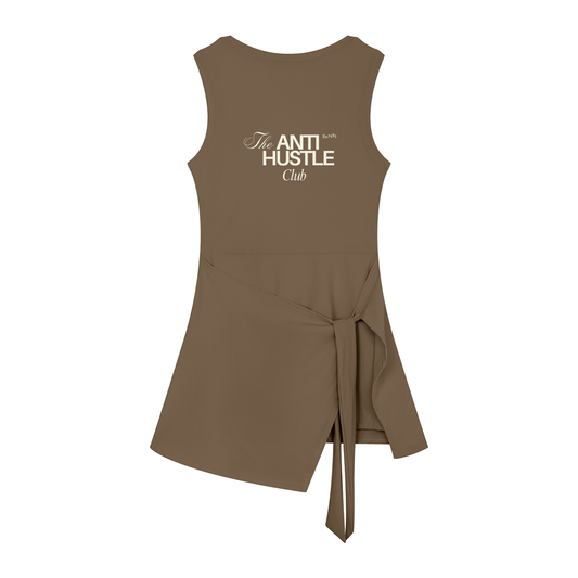 Brown sleeveless dress with a tie detail on a white background, featuring the brand 'Mood By a Millennial.