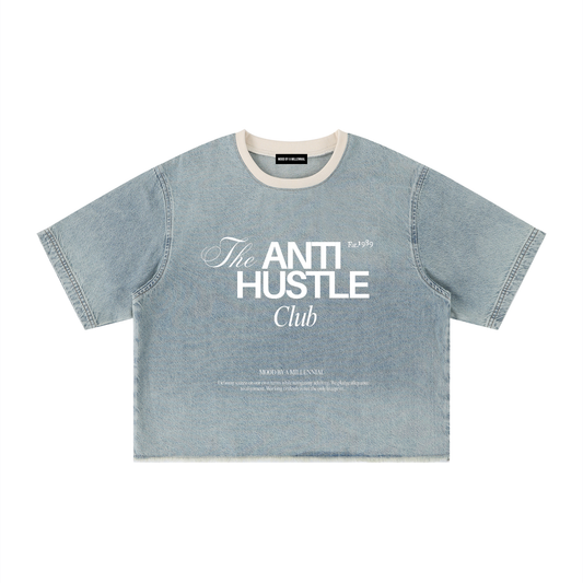 Denim t-shirt with 'The Anti Hustle Club' text on a white background