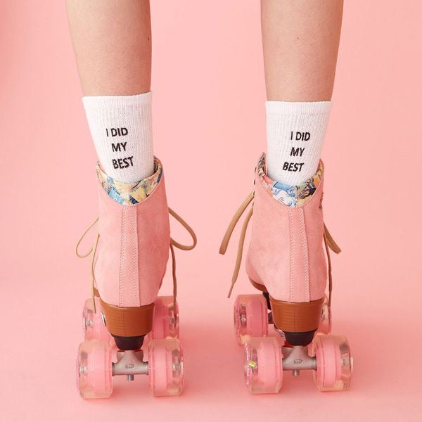 back view of a girl standing in pink roller skates, radiating playful confidence and feminine nostalgia