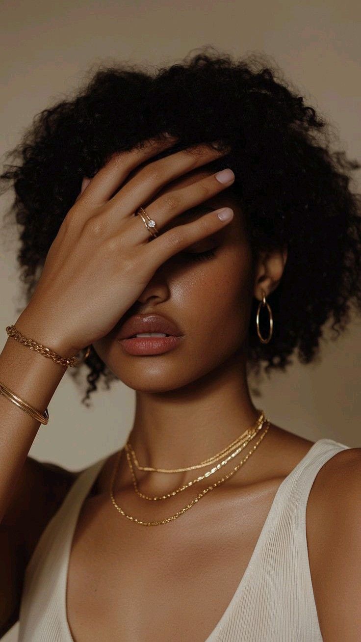 Stressed woman with hand over her eyes, capturing a moment of emotional overwhelm
