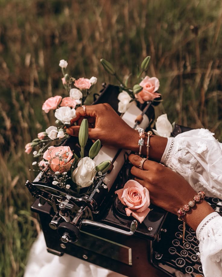Vintage typewriter set in tall grass, symbolizing creativity, reflection, and the natural flow of storytelling.